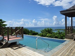 The refreshing pool, with a wrap around deck, gazebo and the gorgeous view beyond.