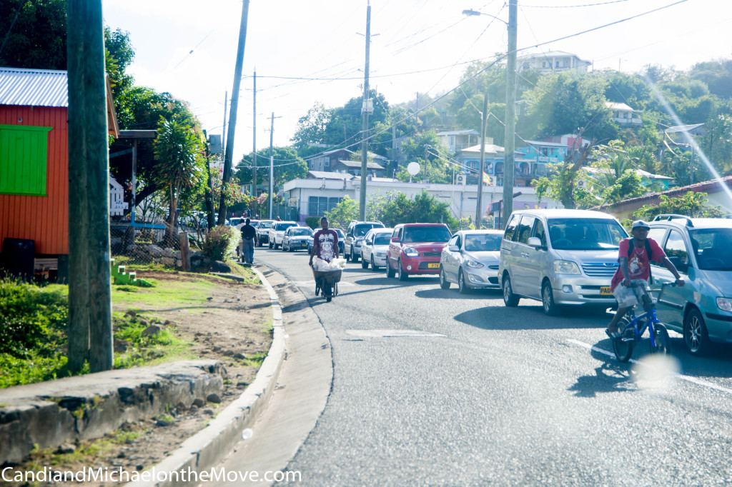 Coming out of the roundabout one morning.  Notice theman waking his wheelbarrow .... in my lane.  No sidewalks here.