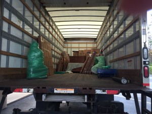 This is the first load from Middelburg with all our 'precious' items. This 10' by 10' load looks tiny in the big moving truck. The green bubble wrapped item is a gorgeous carved Buddha. 