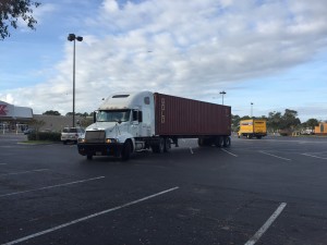 The arrival of the container. Michael is guiding the driver into the parking spot.